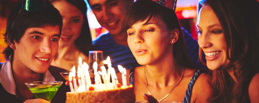Blowing out candles on a birthday cake